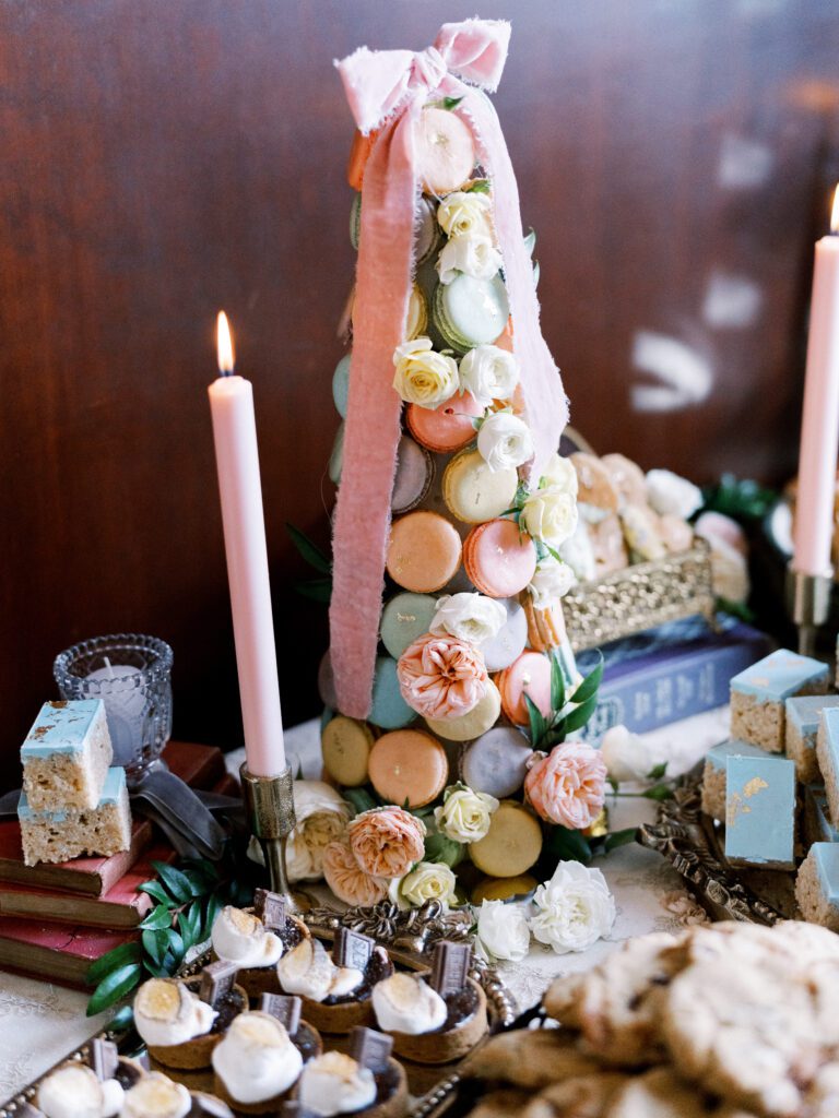 Regency-inspired dessert display featuring macaron tower and styled sweets