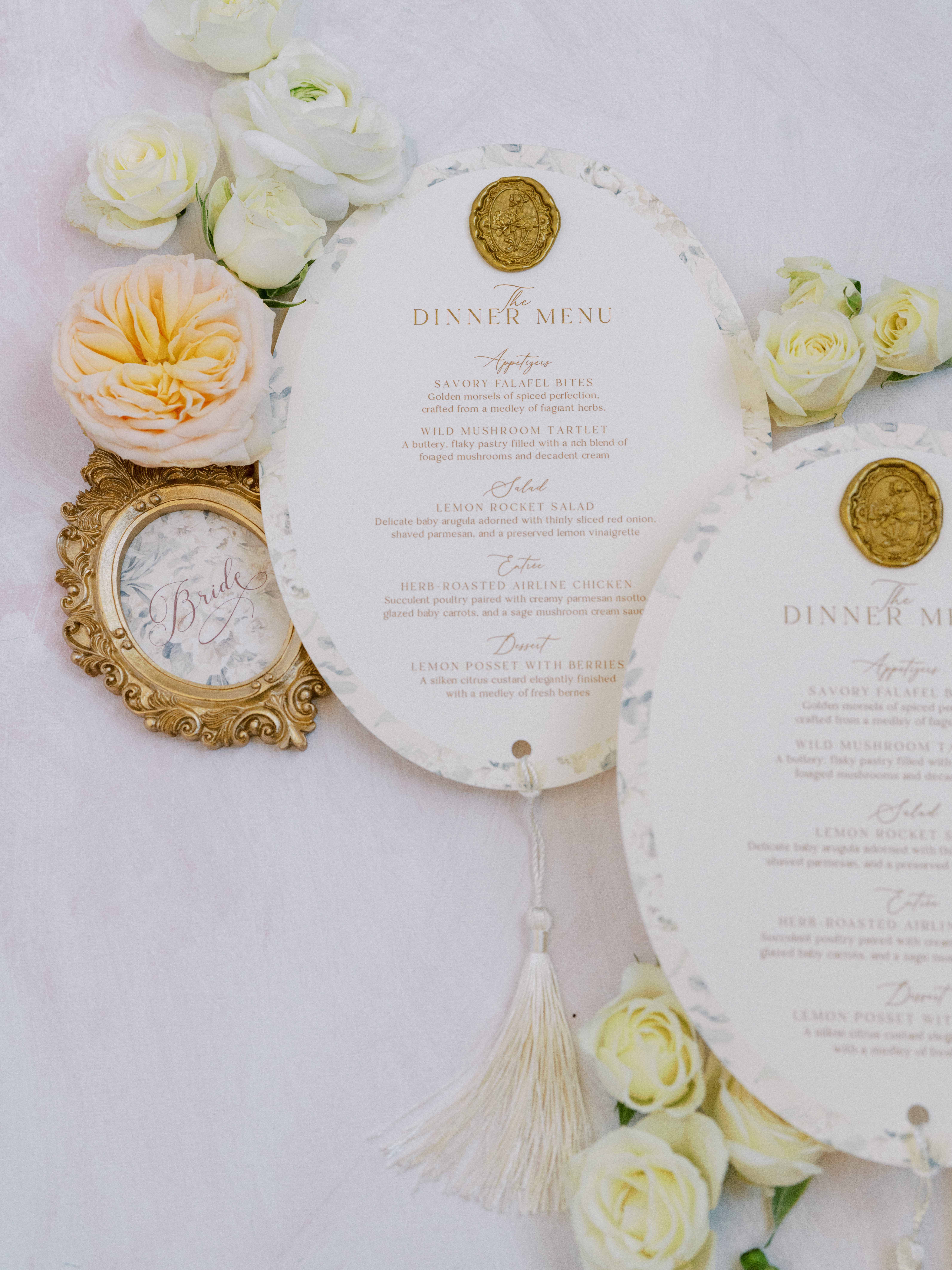 Regency-inspired wedding stationery flat lay with blush tones, florals, and antique details