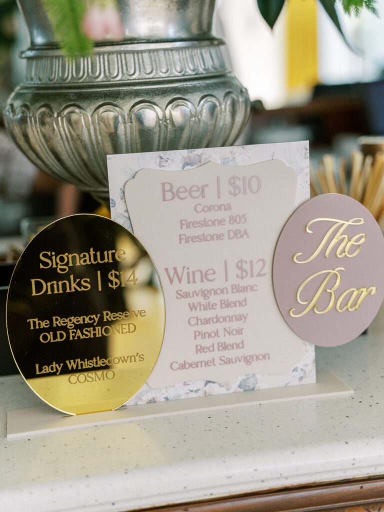 Signature drinks signage styled with gold accents