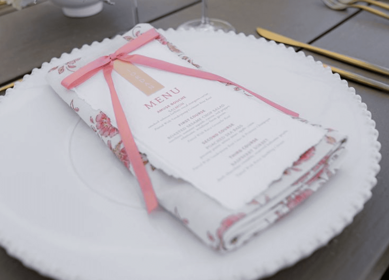 Custom menu with silk ribbon detail for vineyard luncheon at Rava Wines