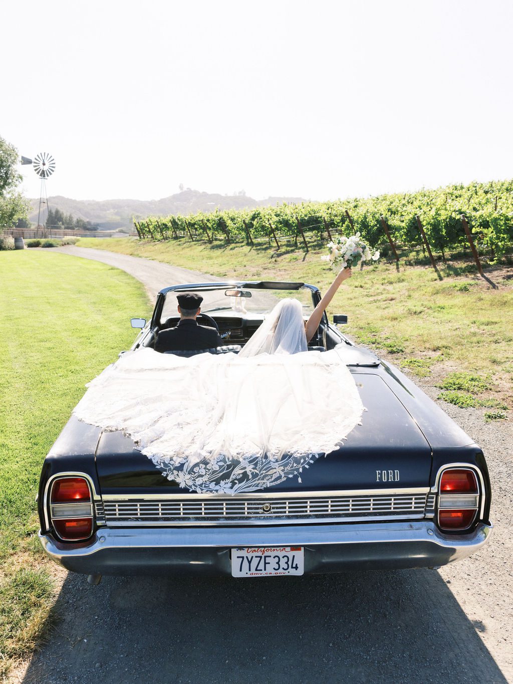 Laura and Ryan riding through the vineyard at Greengate Ranch & Vineyard