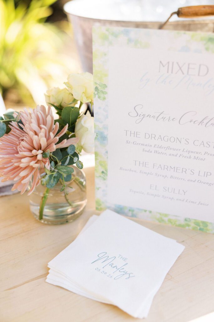 Custom signature cocktail menu and personalized Manley wedding cocktail napkins