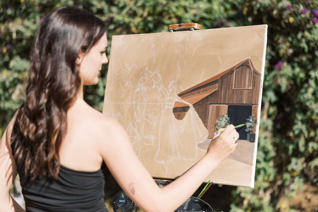 Live wedding painter creating a portrait of Laura and Ryan at Greengate Ranch & Vineyard