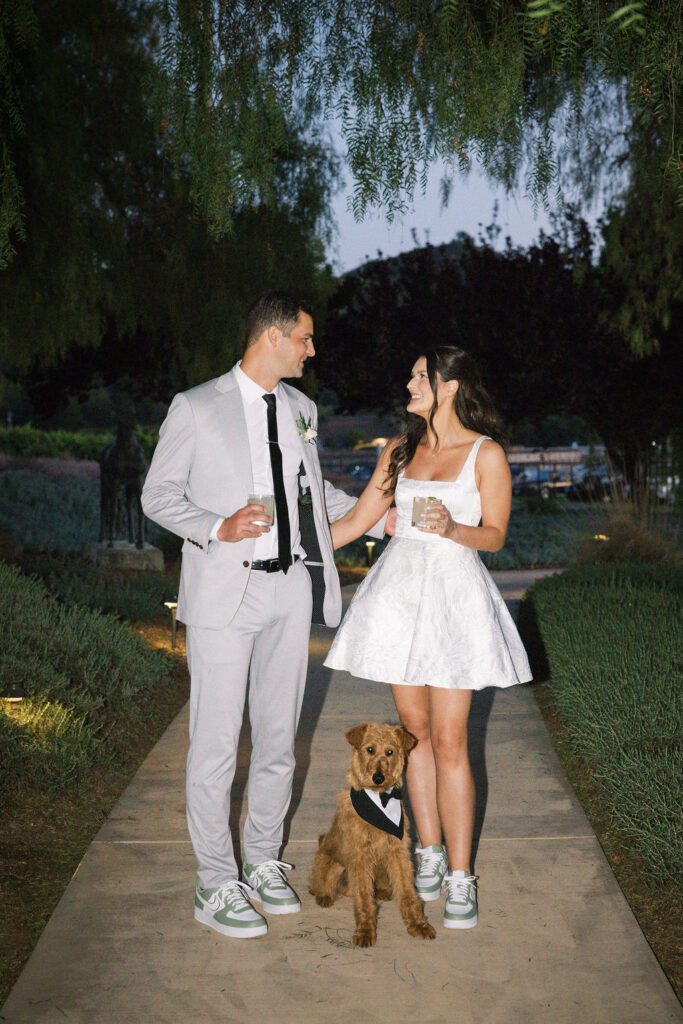 Laura and Ryan with their dog during their Greengate Ranch & Vineyard wedding